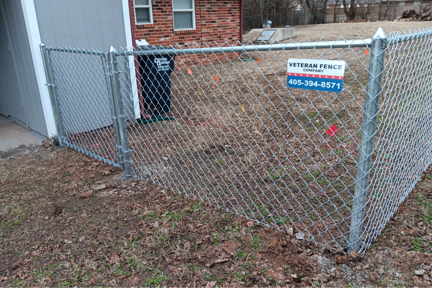 Inside corner of a cedar privacy fence in residential neighborhood.