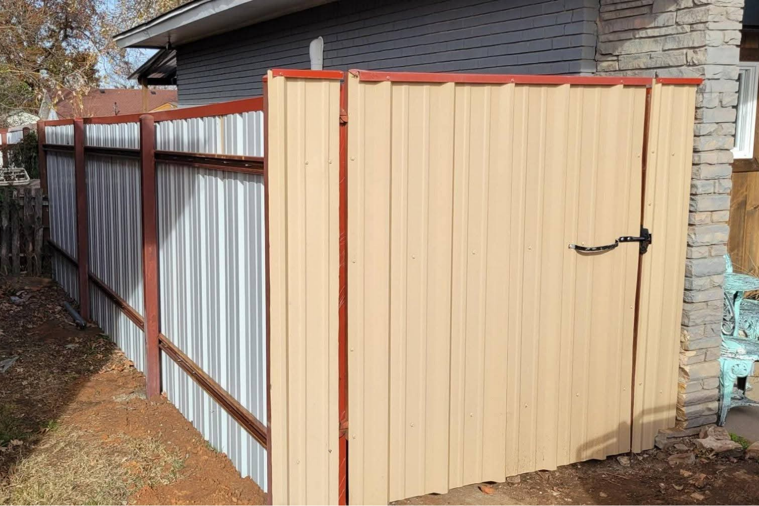 Custom metal fence and gate with corrugated metal.