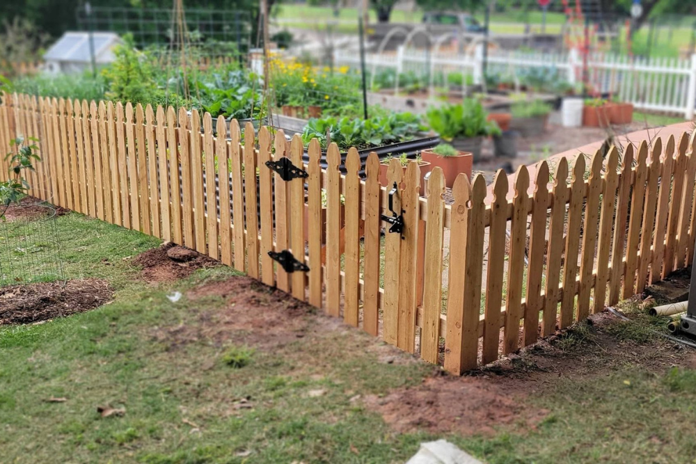 Custom garden fencing with gate.